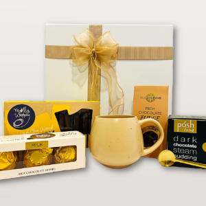 Chocolate gift box NZ with premium chocolate fudge, dark chocolate pudding, hot chocolate bombs, shortbread fingers, mug, and golden spoons
