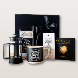 Coffeelovers gift box with coffee plunger, Coffee Good Vibes mug, Colombian coffee, Lindt chocolate, cumin biscuits, and silver spoons.