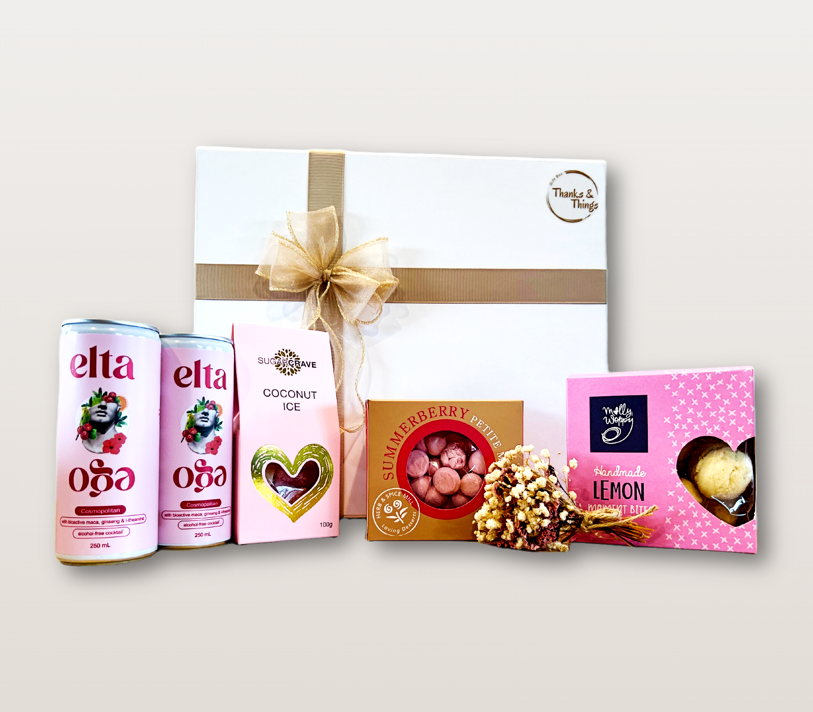 Cosmopolitan Gift Box NZ with alcohol-free cocktails, coconut ice, meringues, lemon cookie bites, and dry flower bouquet