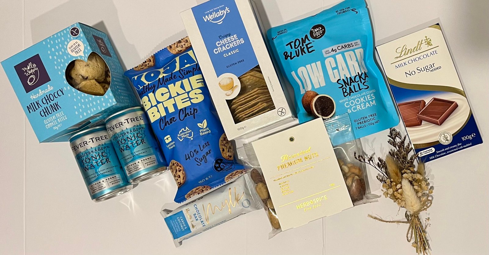 Healthy Gift Box NZ with gluten free snacks, low sugar chocolate, nuts and dried flowers in gift box