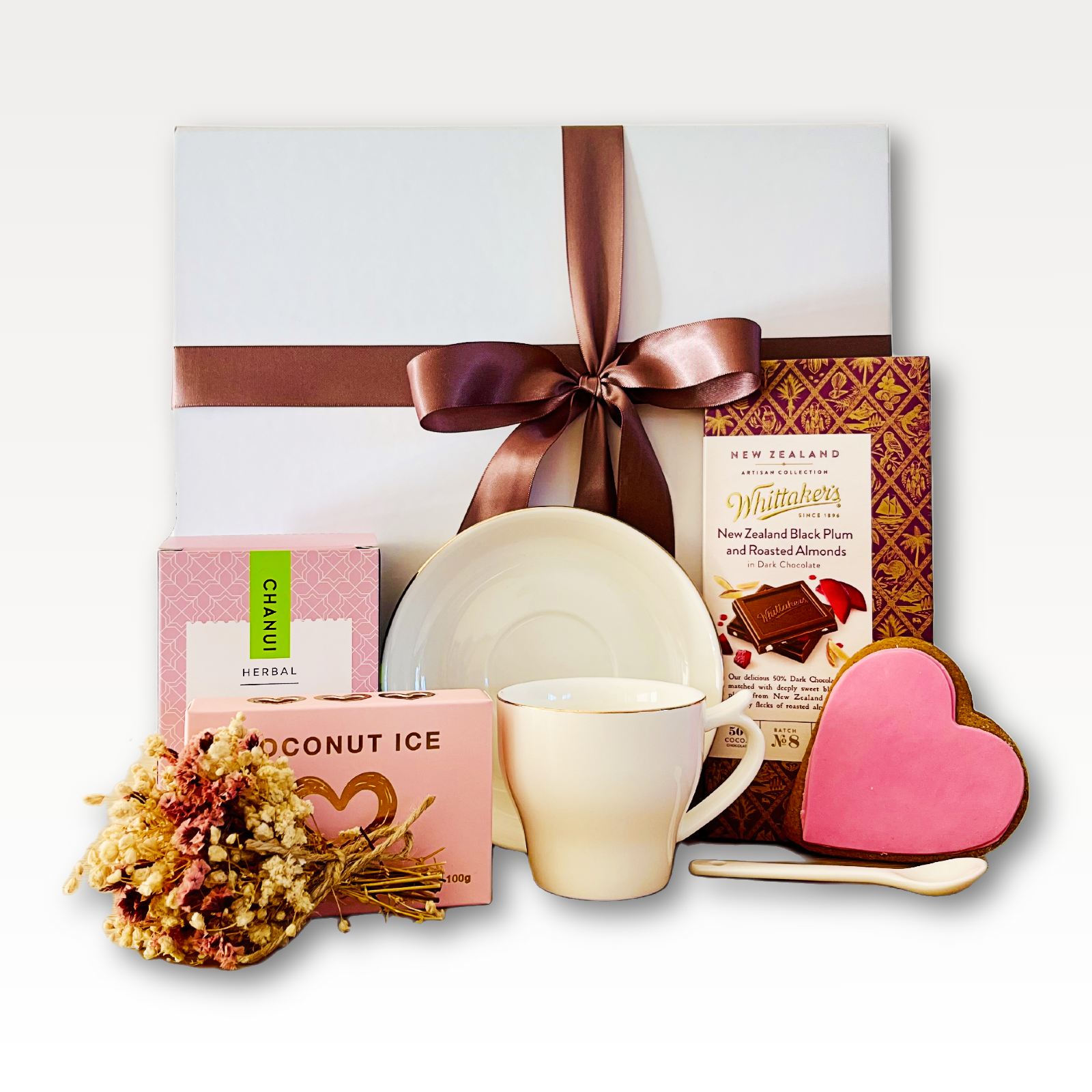 Hug in a Cup Tea Gift Box NZ with chamomile tea, artisan chocolate, coconut ice, gingerbread heart cookie and tea mug