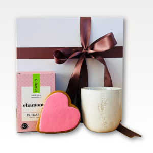 Little Tea Treat Tea Gift Box NZ with chamomile tea, gingerbread heart cookie and ceramic espresso cup.
