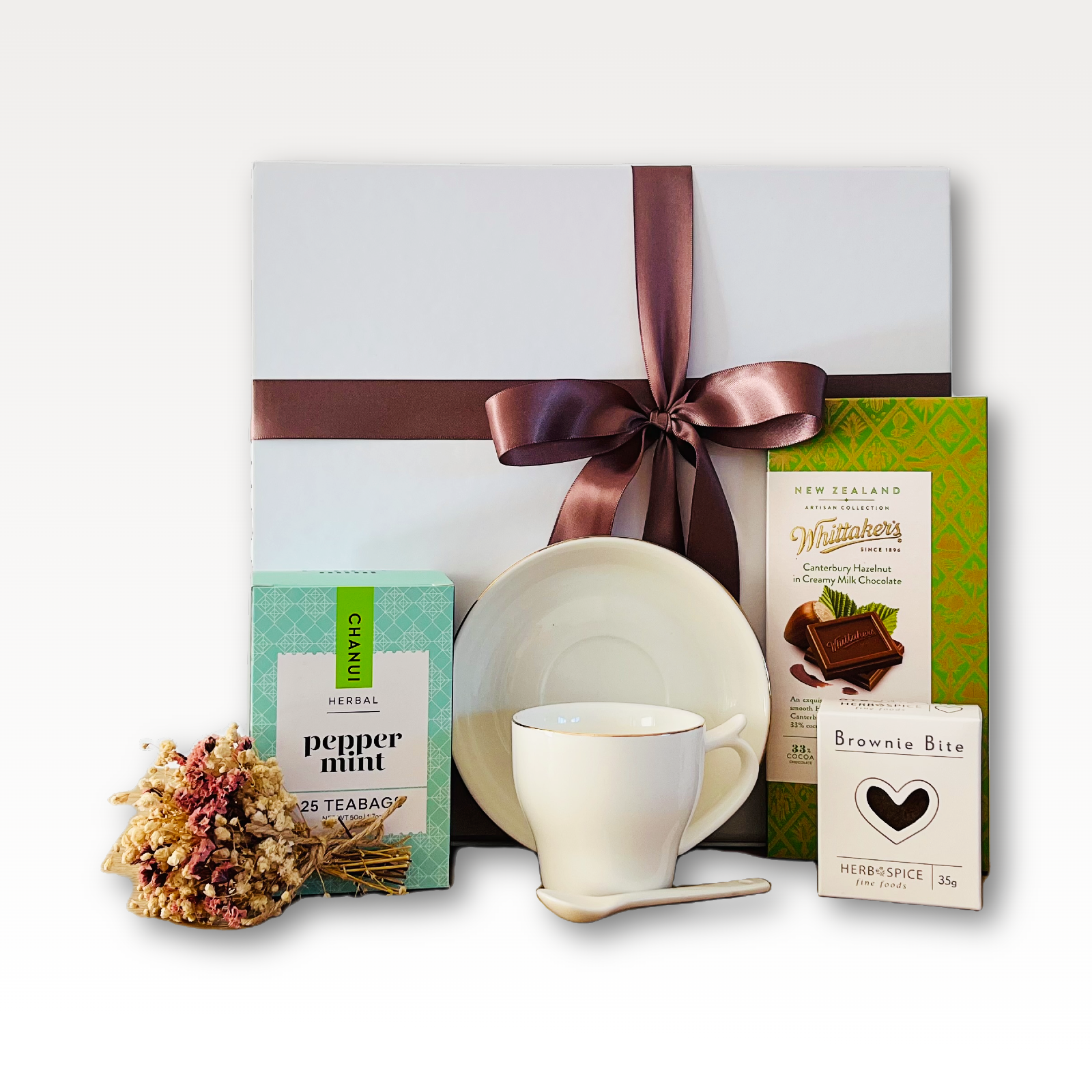 Mint To Be Peppermint Tea Gift Box NZ with peppermint tea, artisan chocolate, mini heart brownie, ceramic mug, and dried flowers.